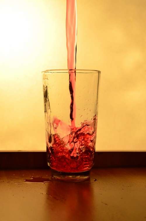 Liquid Red Glass Splash Pouring Alcohol Drink