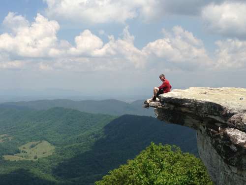 Man Sitting Rock Knob Hiking Mountain