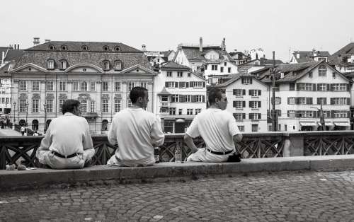 Men Sitting Waiting Wall Urban City Walkway