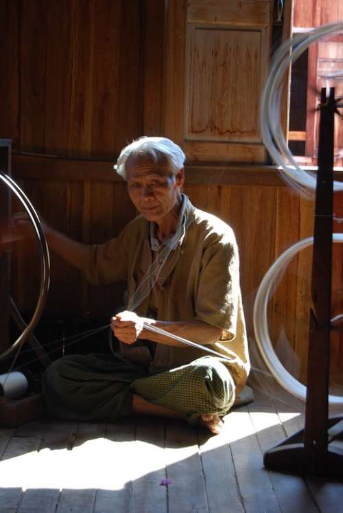 Myanmar Old Man Silk Spinning Traditionally