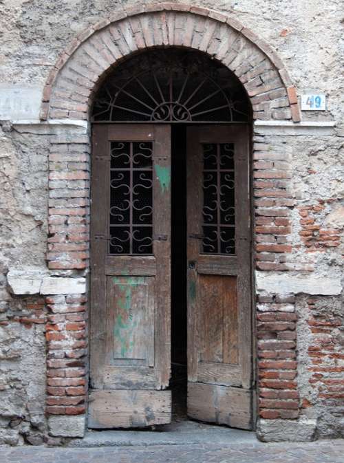Old Doorway Patched Doors Dilapidated Brick Arch
