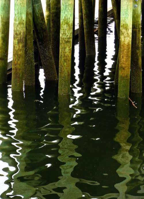 Pier Poles Mirroring Reflection Water Ocean