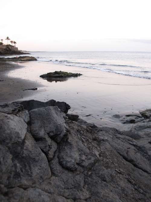 Rock Shore Sunset Sand Beach