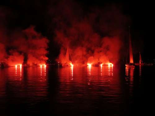 Sailor Torches Lights Lake In Flames Water Boats