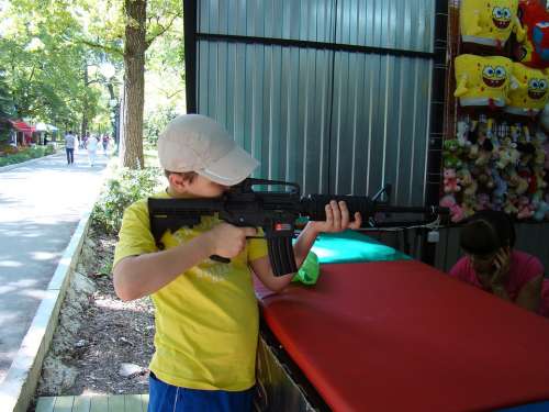 Shooting Gallery Attraction Boy Target Shoots