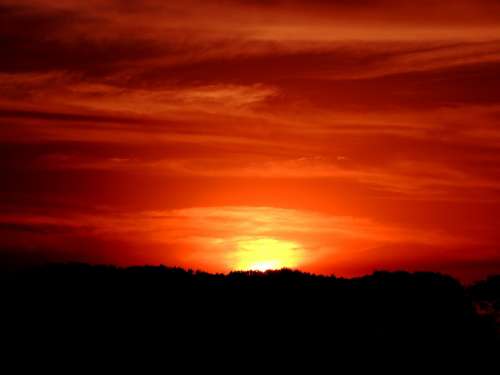 Sol Sunset Against Light Clouds In The Sun