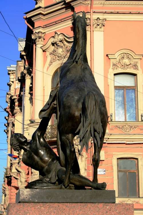 Statue Equestrian Man Breaking Horse Buildings Sky