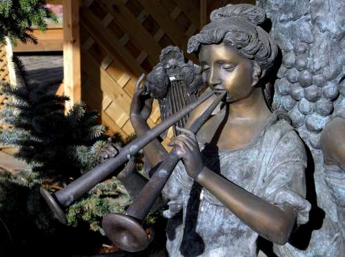 Statue Bronze Music Instrument Female Sun Closeup