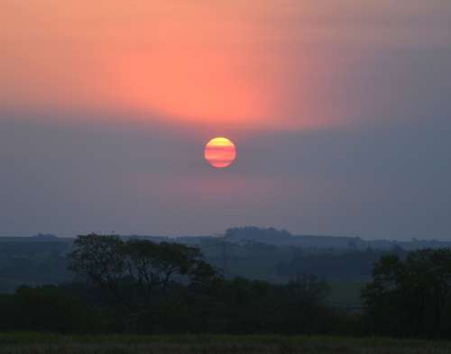 Sunset Against Light Clouds In The Sun