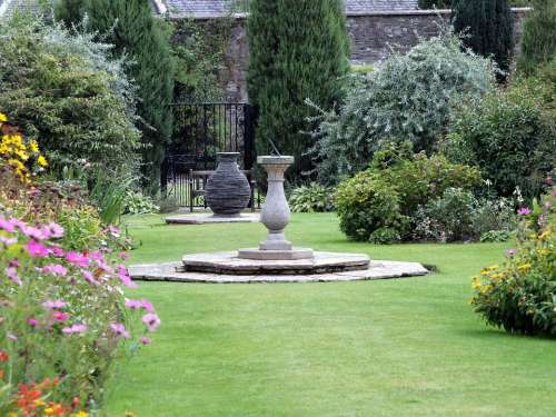 Urn Garden Plants Slate Sundial Grass Lawn