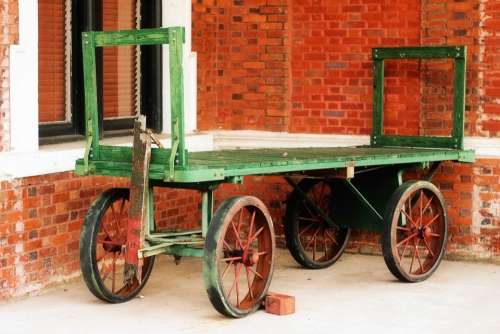 Wagon Wheels Brick Wall Green Orange