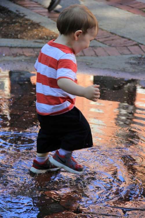 Wee Kid Splashes Water