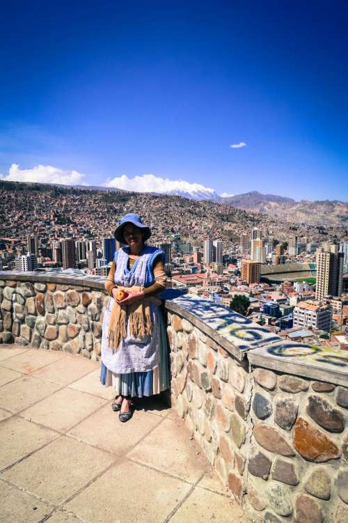 Quechua lady with La Paz in the background, Bolivia.