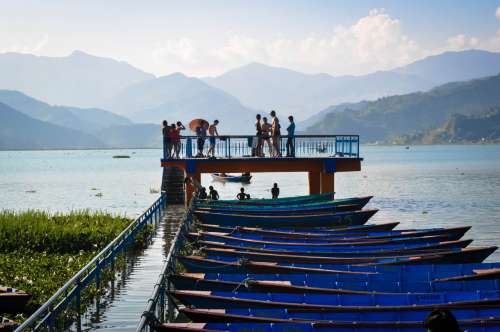 Boats docked along Fewa Lake, Pokhara, Nepal.