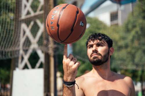 Man Spinning Basketball On Finger Photo