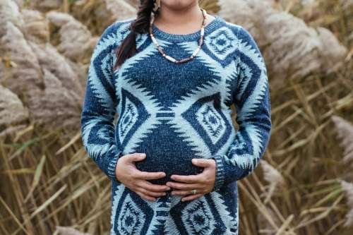 Pregnant Woman In Field Photo