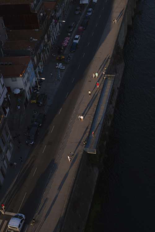 Aerial View Of People Scrolling Across A Boardwalk Photo