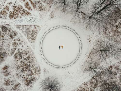 Aerial View Of Two Snow Angels Surrounded By Trees Photo