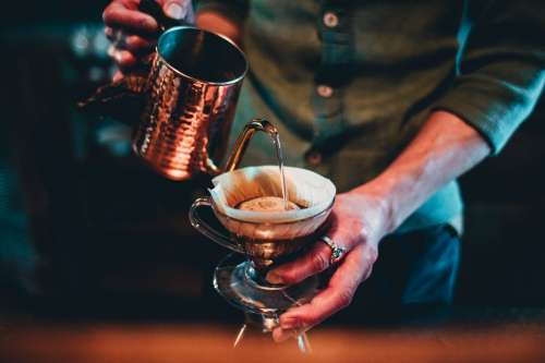 Barista Pour Over Coffee From Copper Kettle Photo