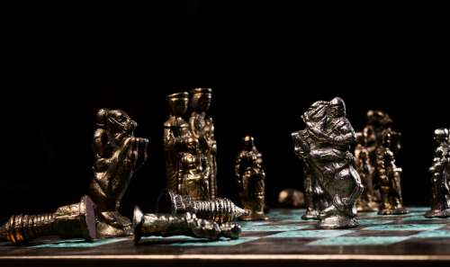 Battling Knights On A Chess Board Photo