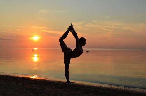 Beach Yoga Pose- In Sand At Sunset Photo
