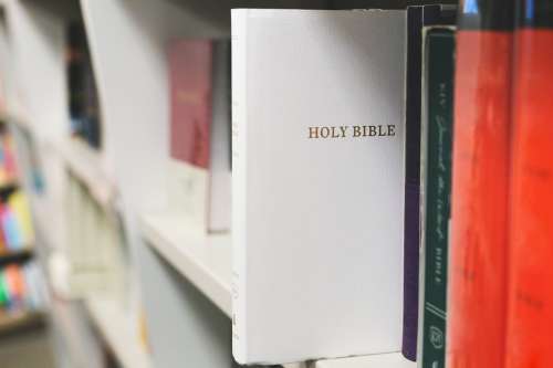 Bible On Book Shelf Photo