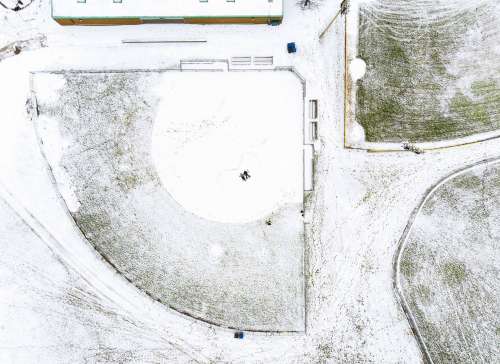 Bird's-Eye Of Couple In Snow-Covered Field Photo