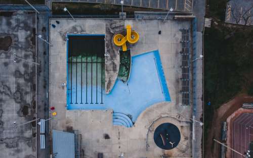 Birds Eye View Of Empty Pool With Waterslide Photo