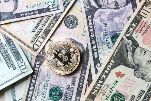 Bitcoin Coin On Bills Of Cash Money Photo