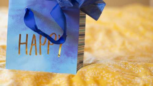 Blue Gift Bag With Gold Lettering Photo