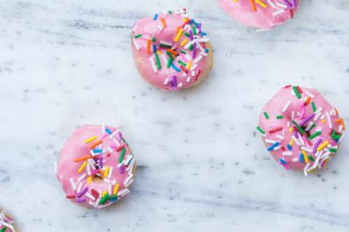 Bright Pink Donuts With Sprinkles Photo