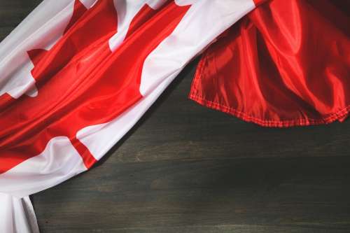 Canadian Flag On Woodgrain Photo