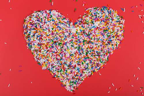 Candy Sprinkles In Heart Shape Photo
