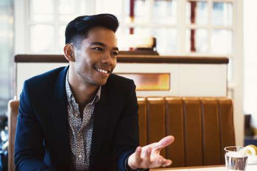 Casual Talking At Restaurant Table Photo