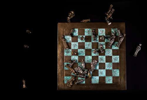 Chess Board With Fallen Pieces Photo
