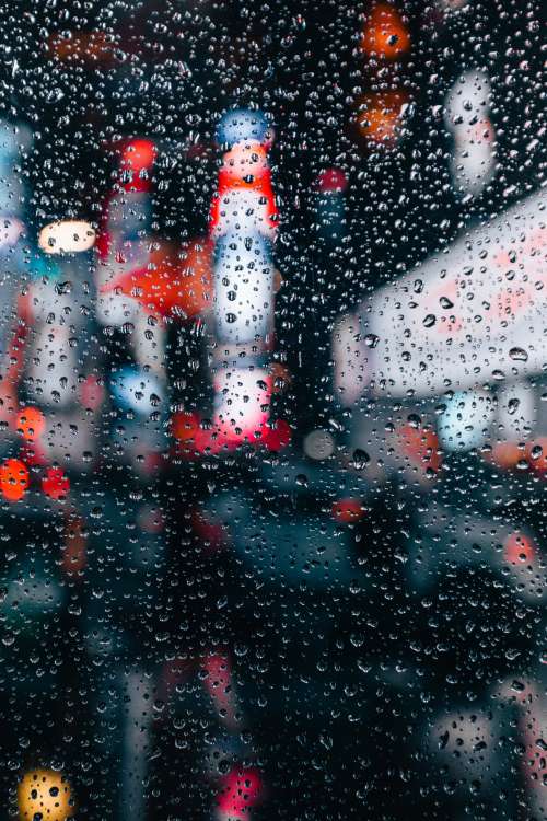 City Lights Through Rain Window Photo