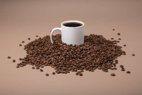 Coffee Mug In Beans Photo