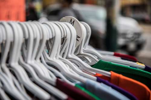 Colorful T-Shirts On Clothing Rack Size Medium Photo