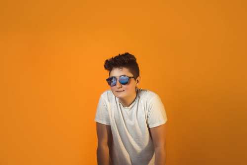 Cool Androgynous Person In Aviators And White Tshirt Photo