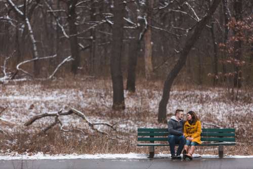 Couple In Love On Park Bench In Winter Photo