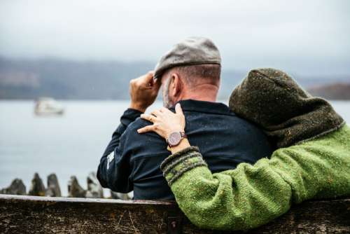 Couple Sits In British Rain Photo