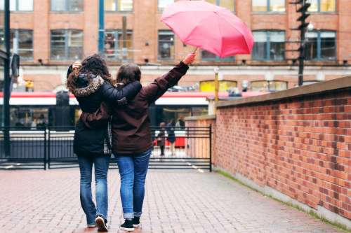 Couple Walking In Rain Photo