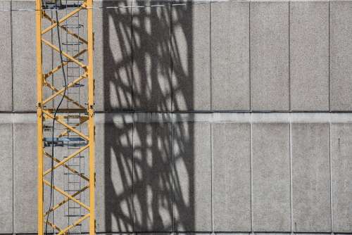 Crane Shadow On Building Photo