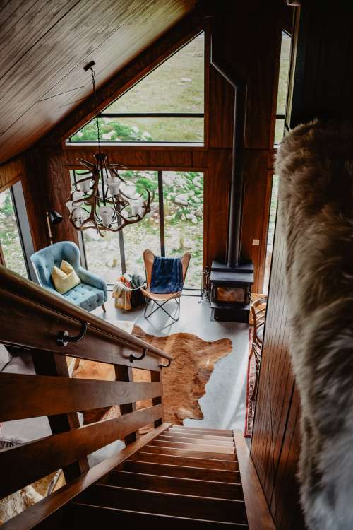 Down The Stairs Of A Wooden Cabin Photo