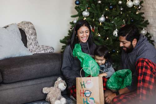 Family Unwrapping Holiday Gifts Photo