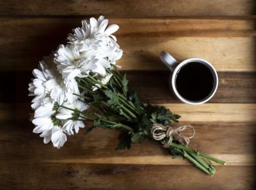 Flowers And Coffee Photo