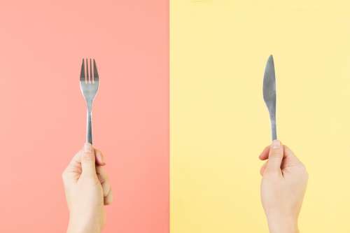 Fork And Knife In Hands Photo