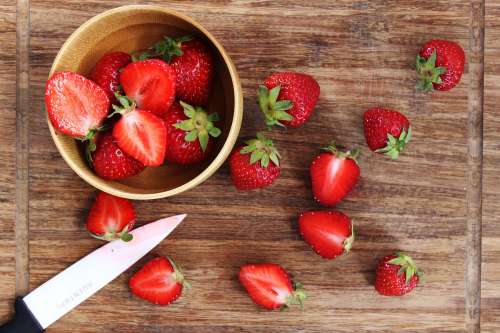 Fresh Strawberries Being Cut Photo