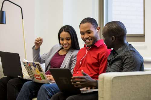 Friends Look On Laptop Photo