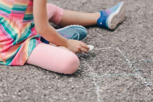 Girl Holding Sidewalk Chalk Photo